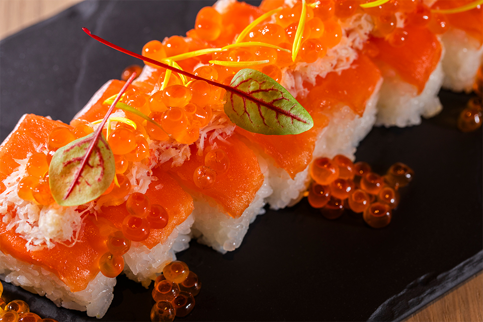 Salmon sushi topped with salmon roe